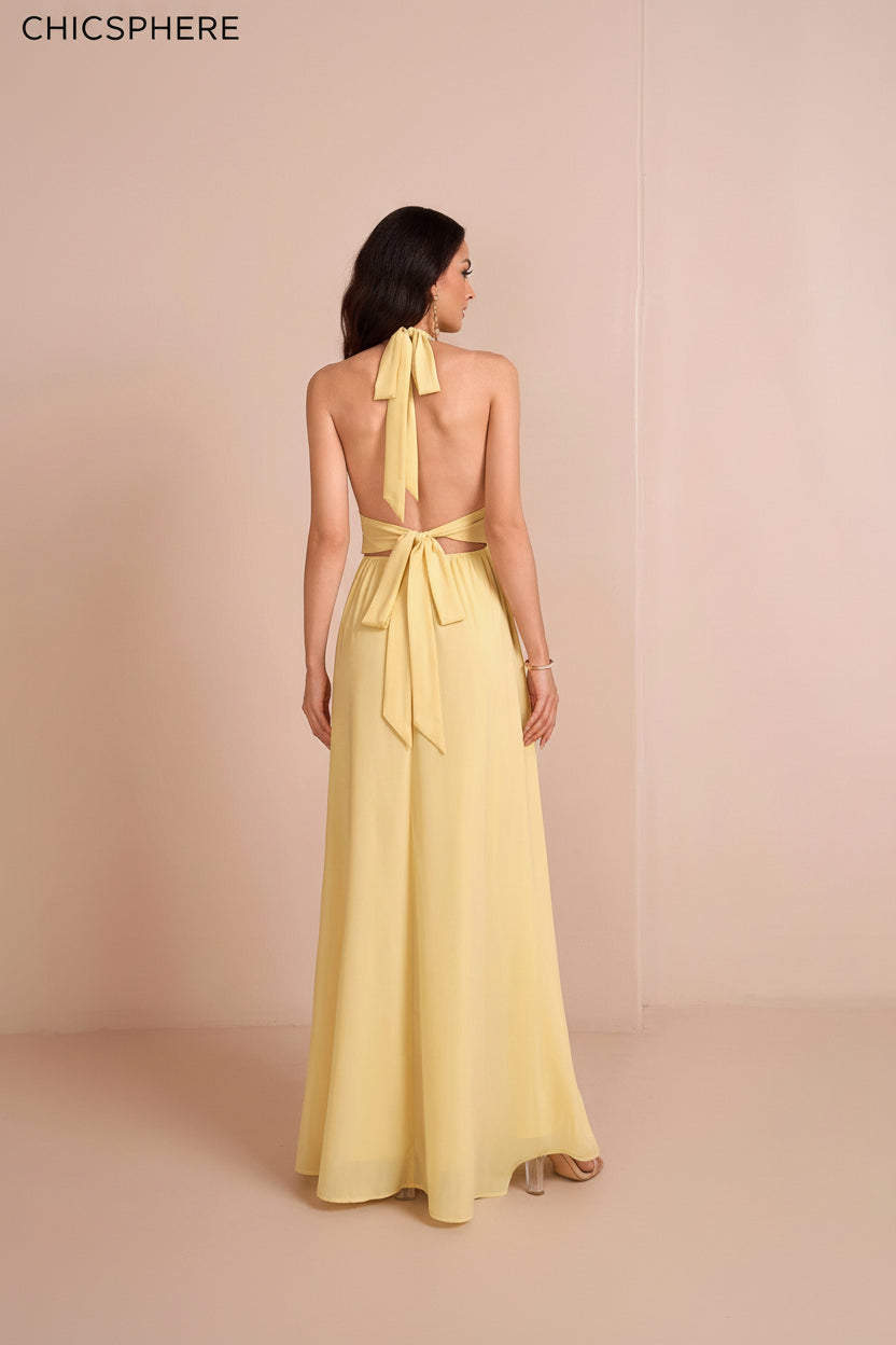 Yellow evening gown with open back on a beige background