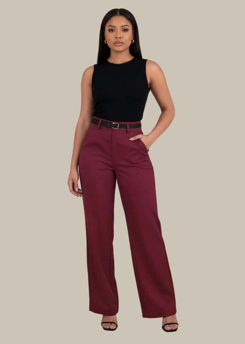 Maroon pants worn by a person on a white background