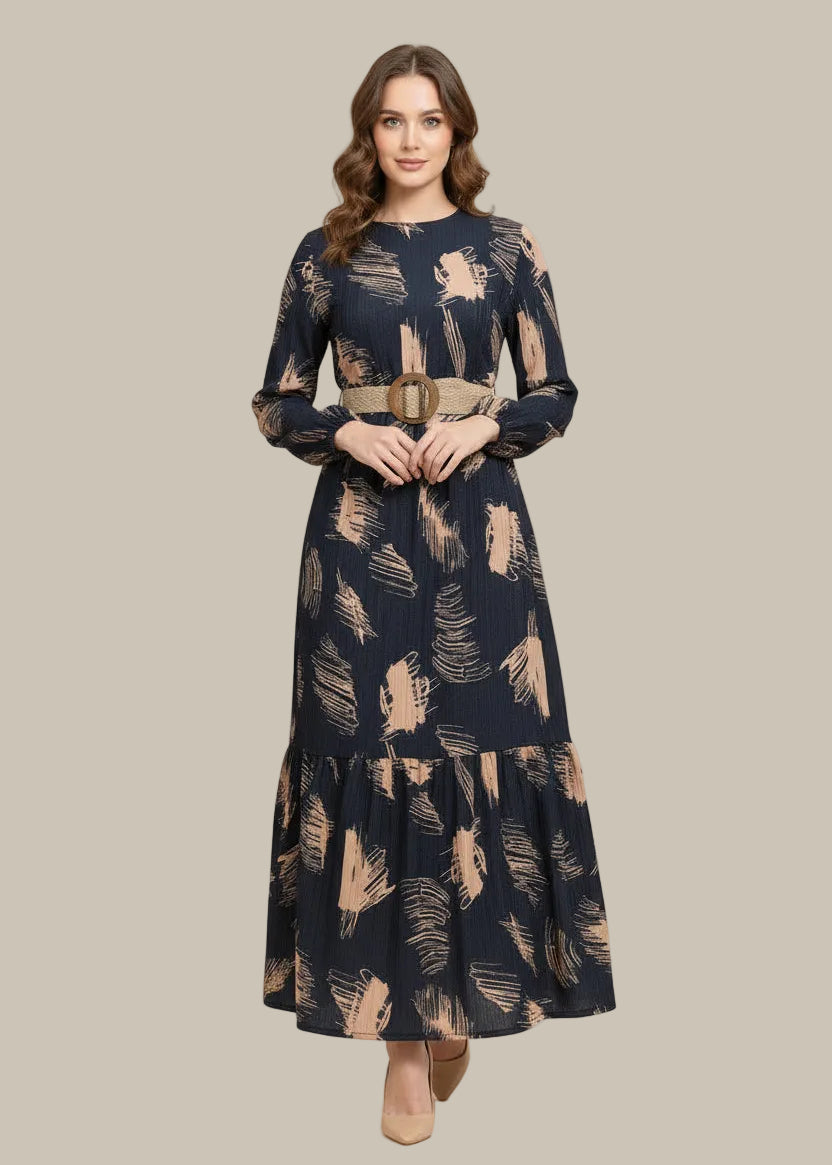 Woman wearing a navy dress with beige abstract patterns on a beige background